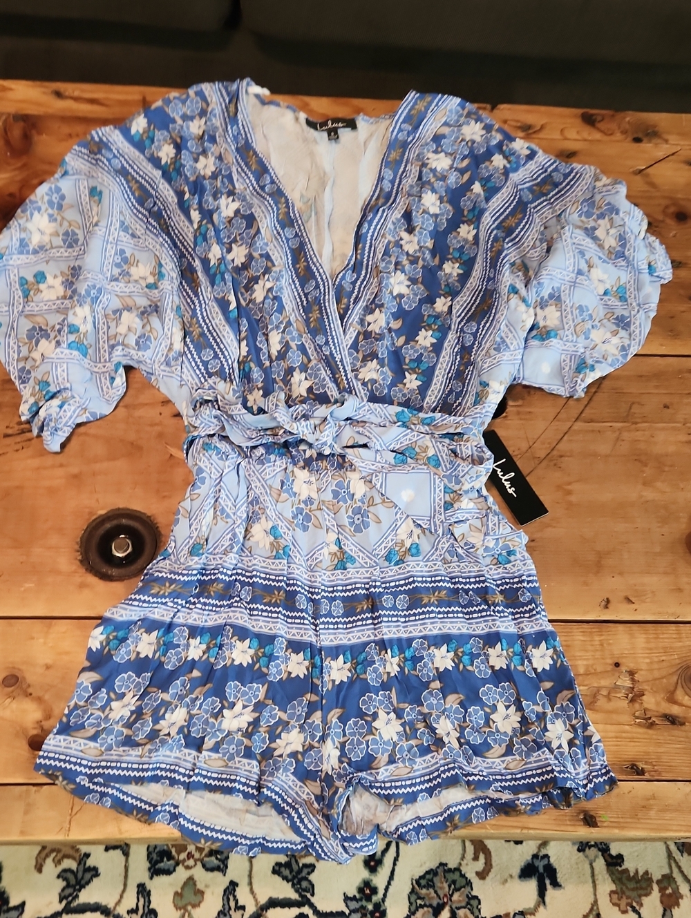 Lulu's Blue Floral Wrap Romper with Tie Waist